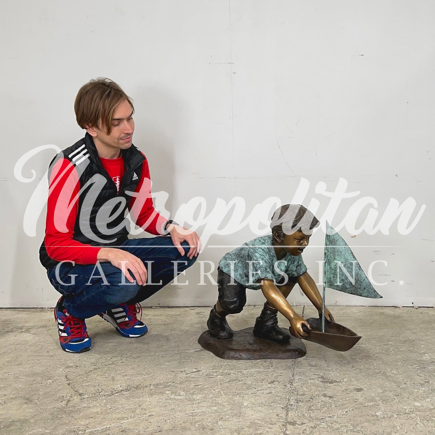 Boy with Sailboat Bronze Statue