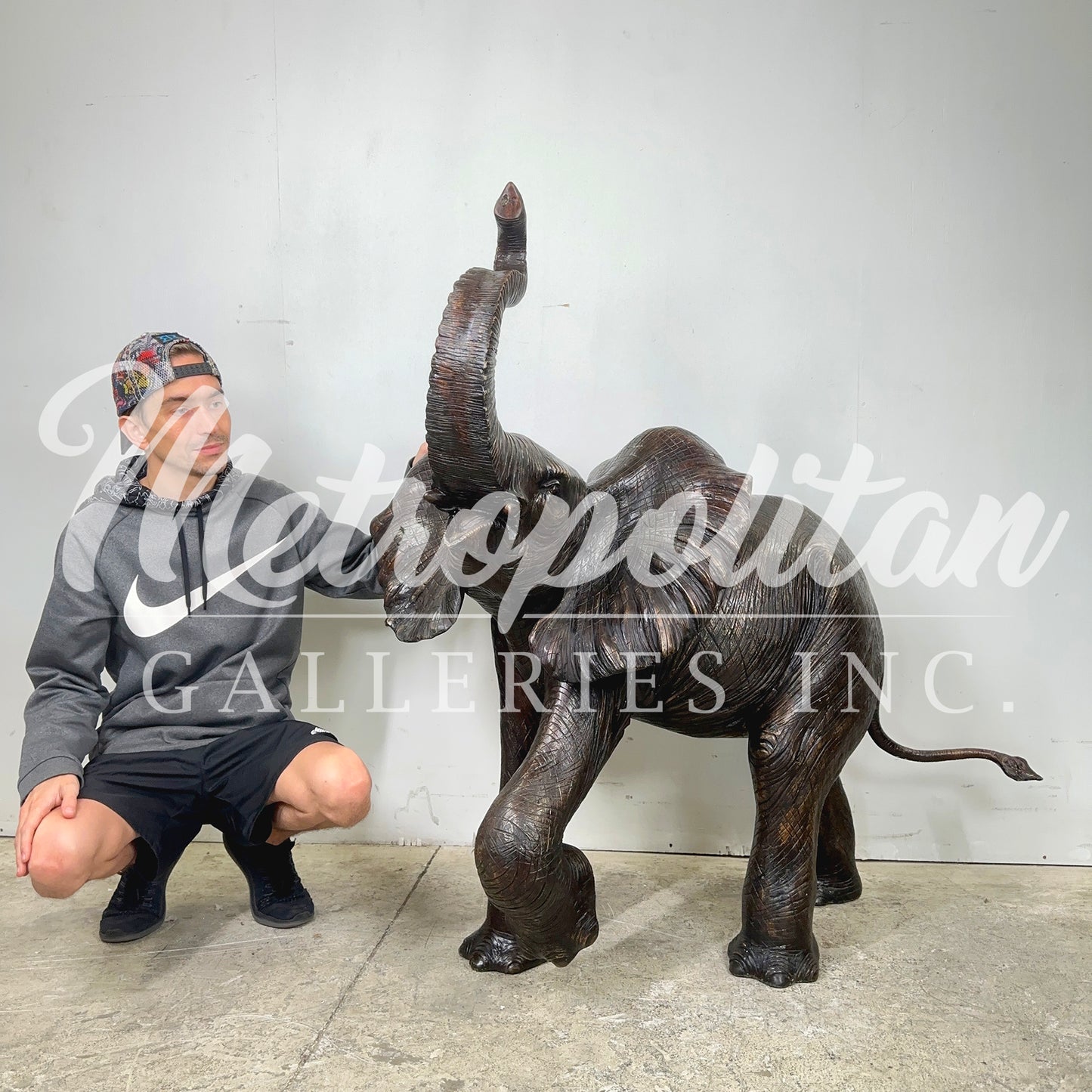 Walking Baby Elephant Bronze Statue